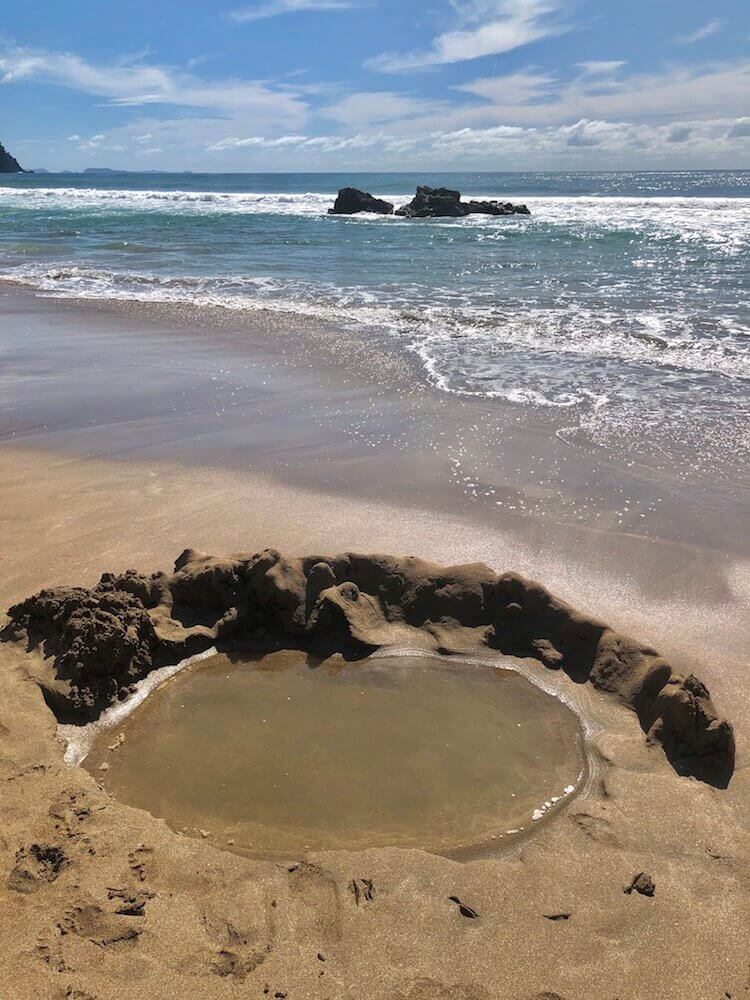 Hot Water Beach, North Island: Imagine yourself digging in the sand and having hot water coming out! At low tide, you can fully experience this wonder of nature.