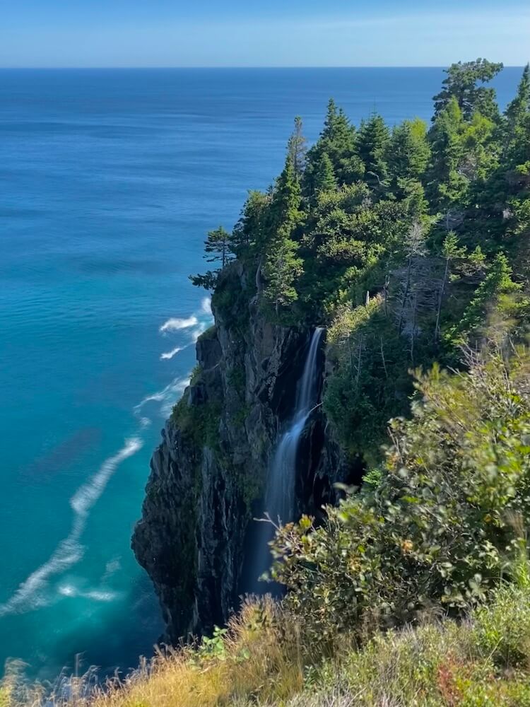A waterfall landing right into the sea